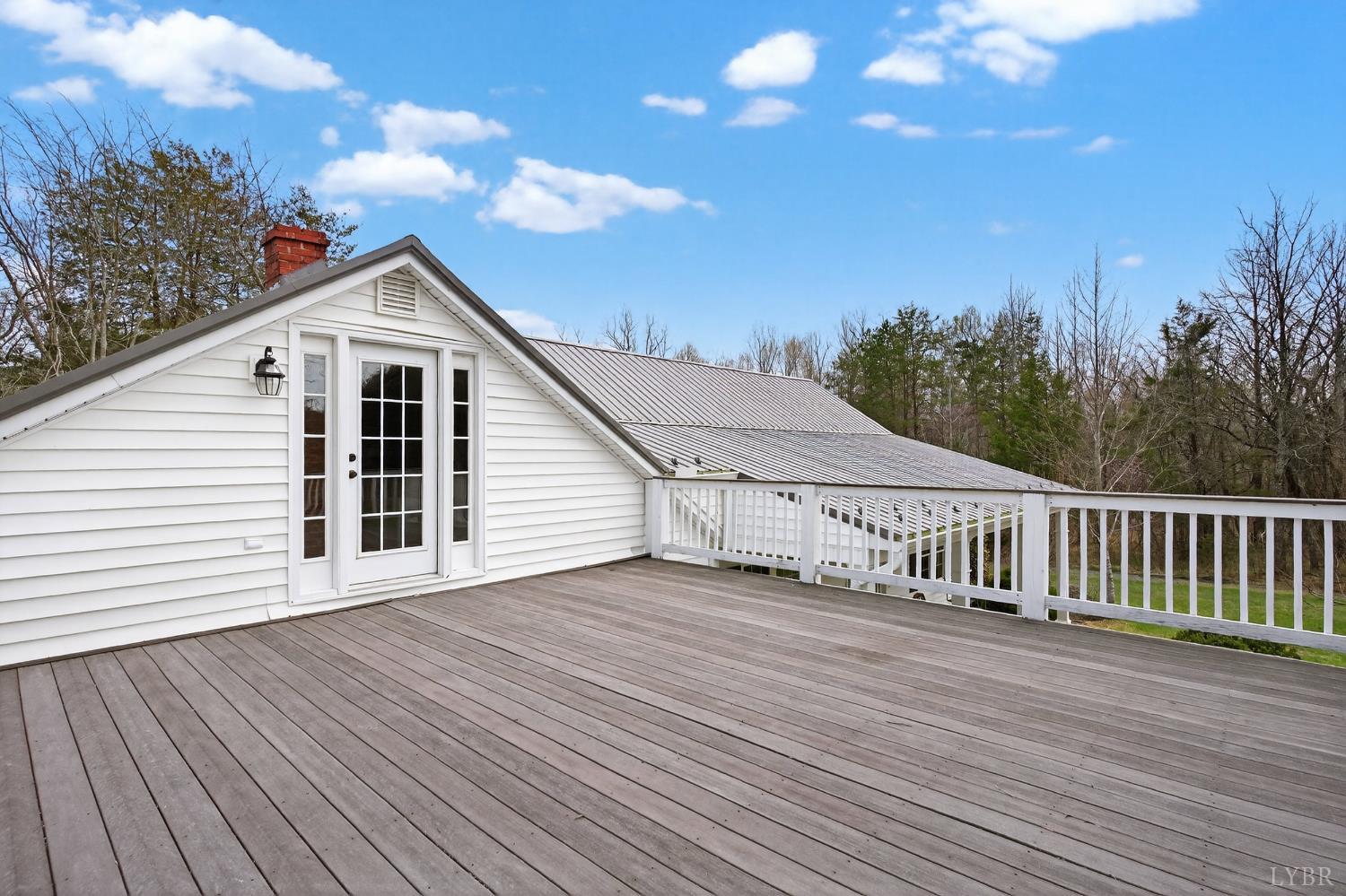 3805 Whipping Creek Road Gladys, VA 24554 - Photo 44 of 96 a view of a house with a deck