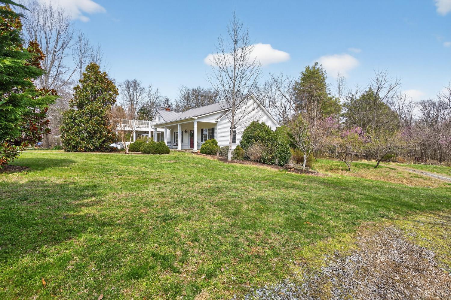 3805 Whipping Creek Road Gladys, VA 24554 - Photo 68 of 96 a front view of a house with a garden and trees