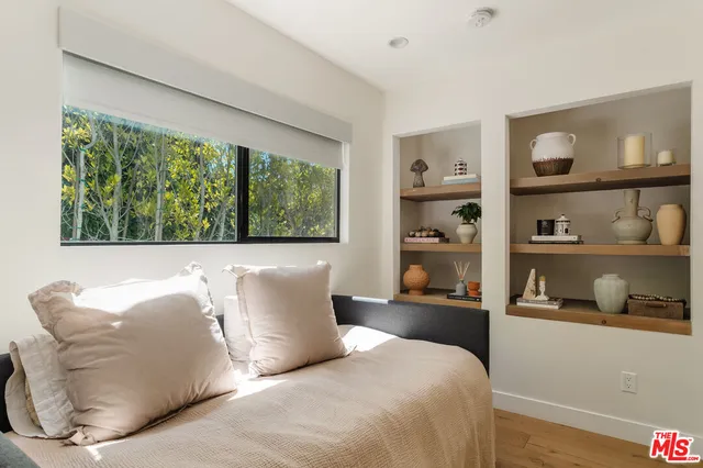 a bedroom with a bed and closet