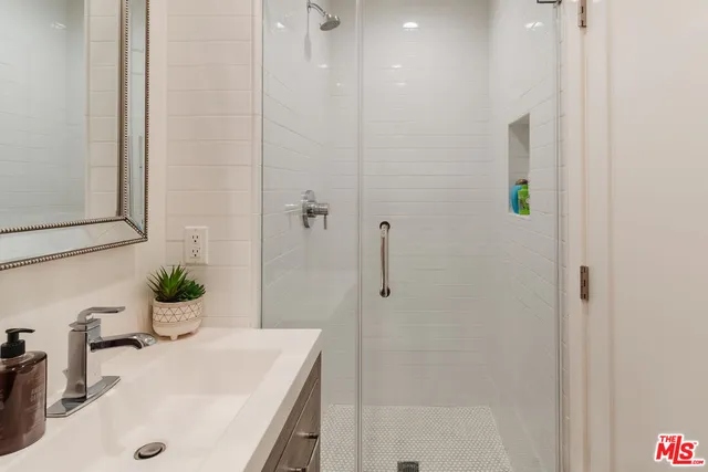 a bathroom with a sink and mirror