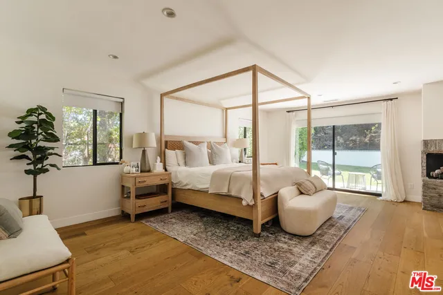 a spacious bedroom with a bed and a couch