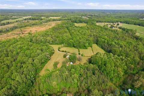a kitchen with stainless steel appliances granite countertop a refrigerator a sink dishwasher a stove and white countertops with wooden floor
