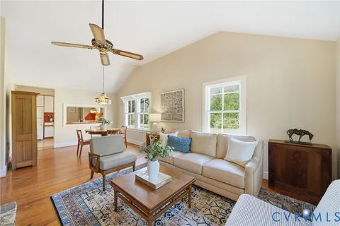 a living room with furniture and a table