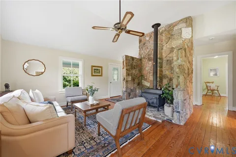 a living room with kitchen island furniture and a kitchen view