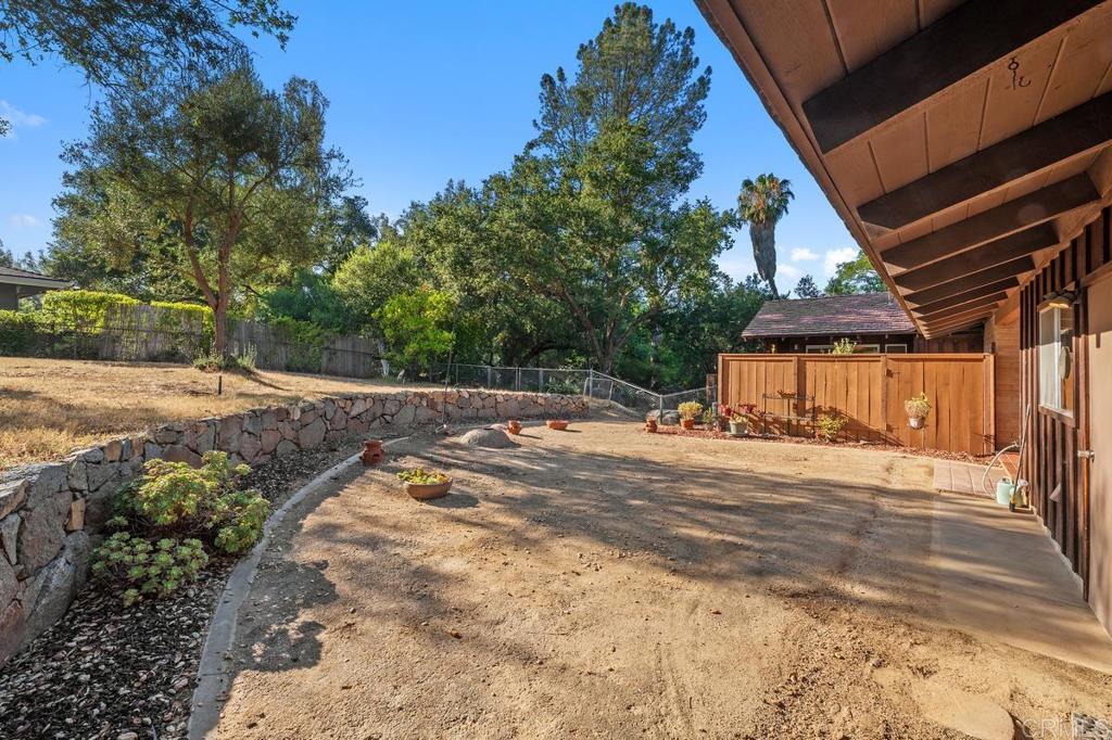 16522 Orchard Bend Road Poway, CA 92064 - Photo 20 of 26 a view of a house with a yard and pathway