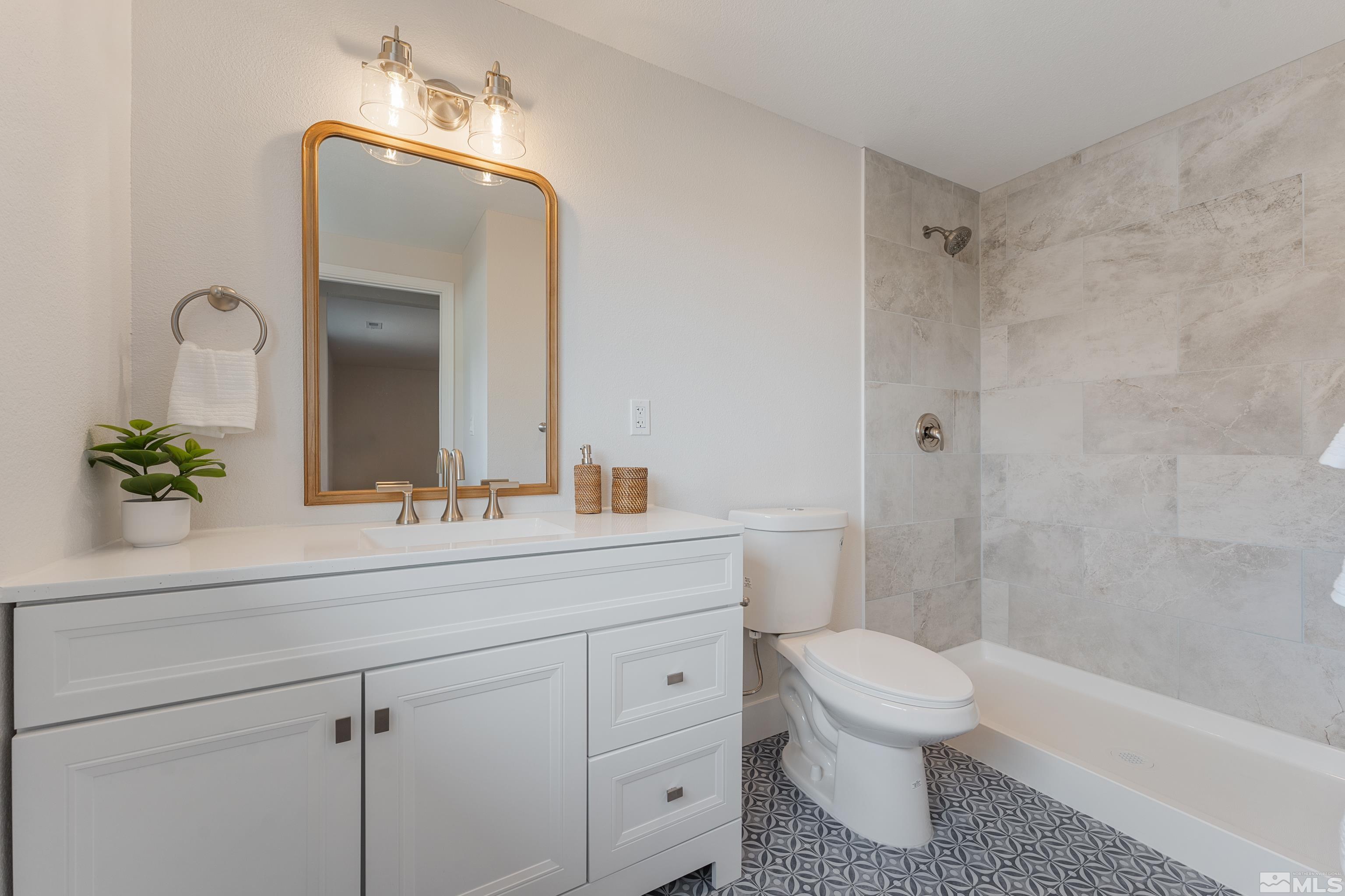 9495 Fremont Way Reno, NV 89506 - Photo 9 of 17 a bathroom with a sink a toilet and shower
