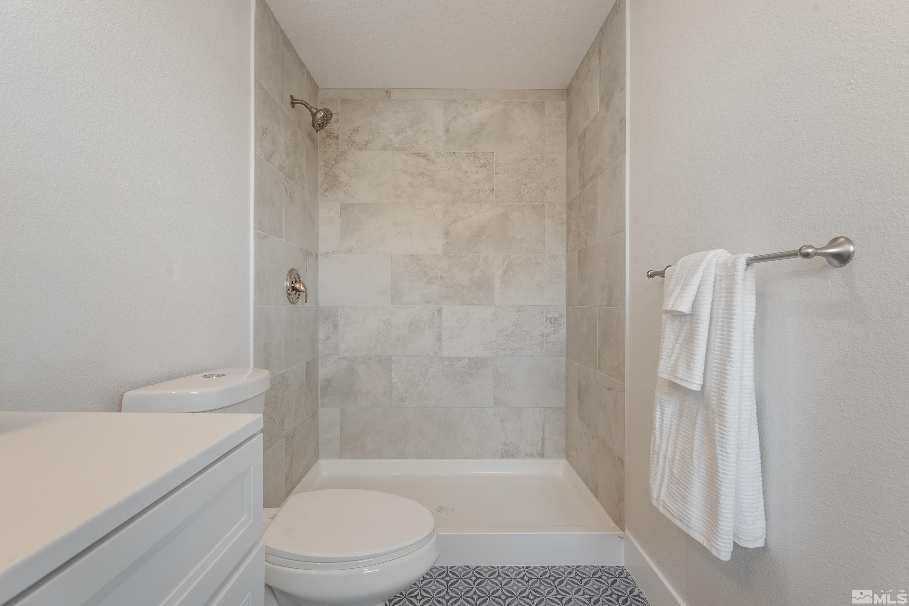 9495 Fremont Way Reno, NV 89506 - Photo 10 of 17 a bathroom with a toilet and a shower