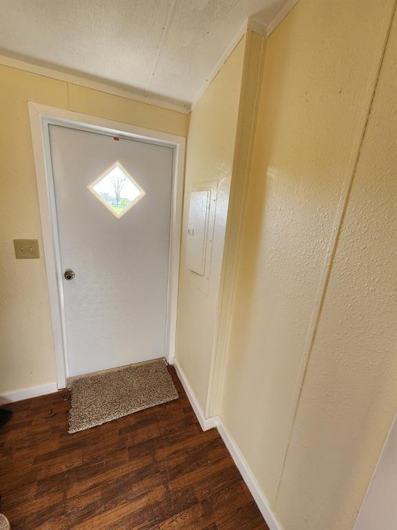 745 North Commerce Street Marquez, TX 77865 - Photo 11 of 11 a view of an empty room with wooden floor