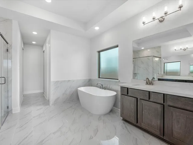 a bathroom with a shower and a sink