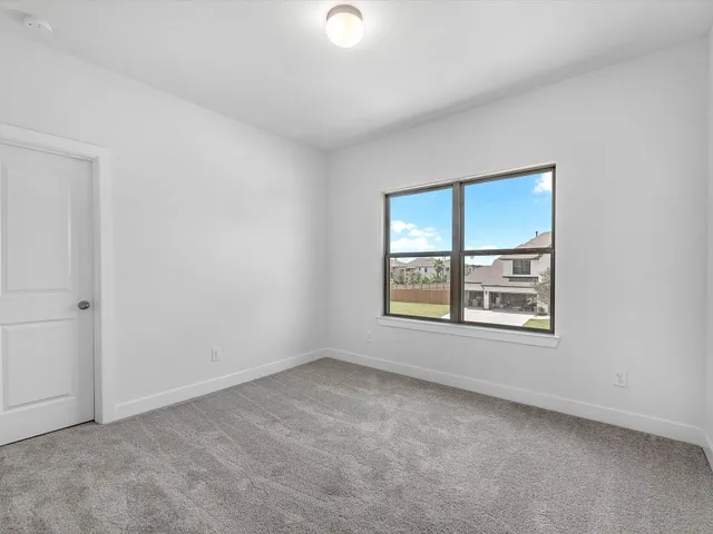 a view of staircase and kitchen with wooden floor