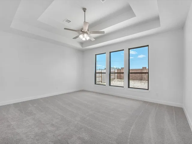 a spacious bathroom with a double vanity sink mirror and bathtub