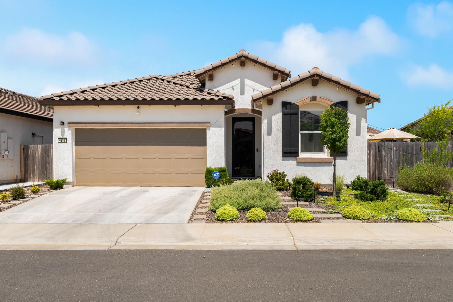 4216 Creede Way Rancho Cordova, CA 95742 - Photo 2 of 56 a front view of a house with a yard and garage