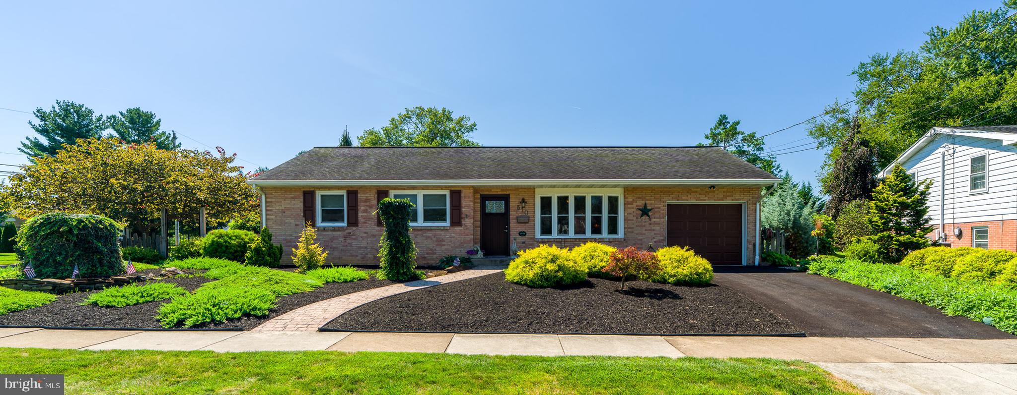 510 Bluebird Road Lititz, PA 17543 - Photo 1 of 32 a front view of a house with a yard and potted plants