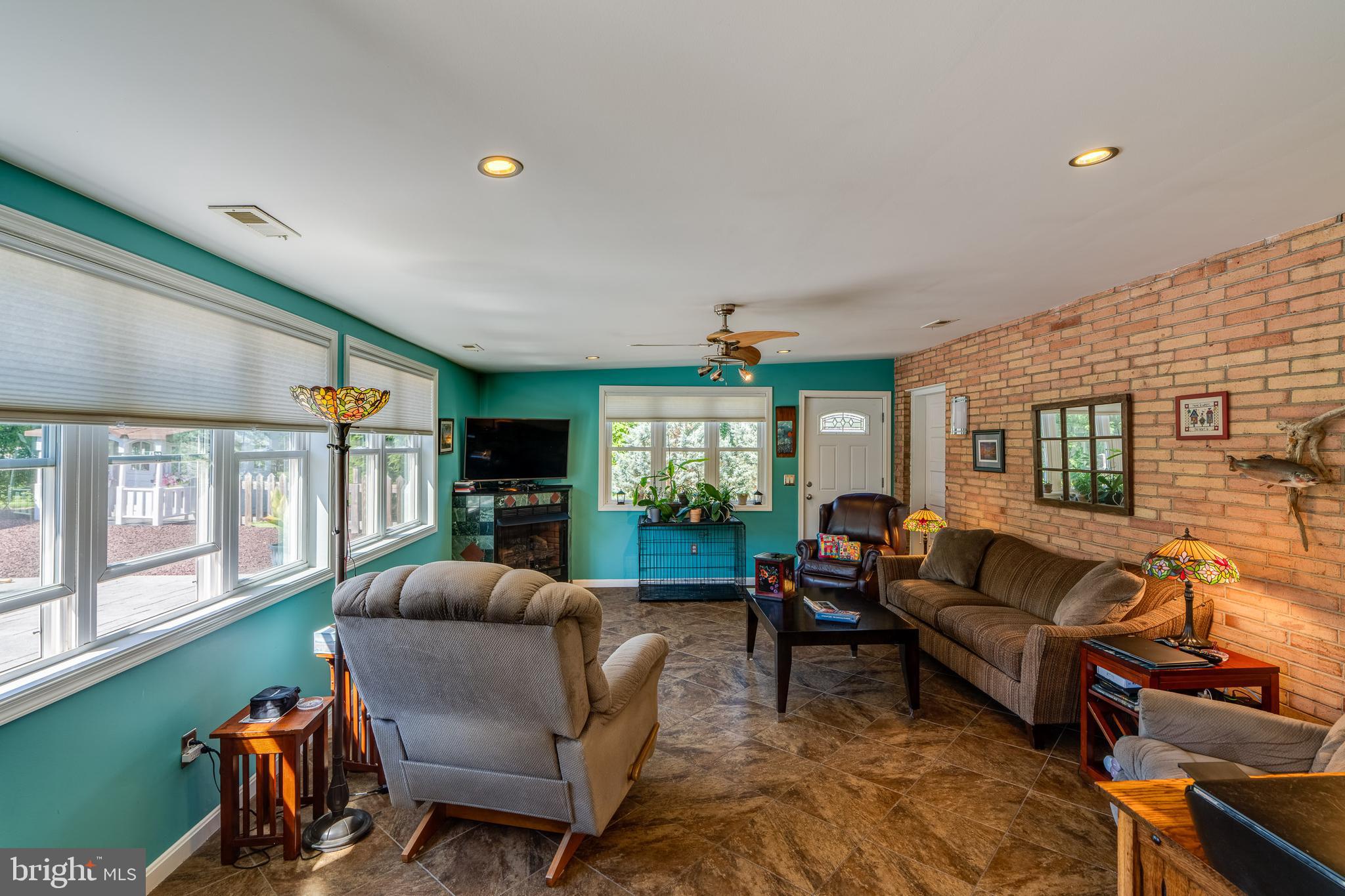 510 Bluebird Road Lititz, PA 17543 - Photo 11 of 32 a living room with furniture and a flat screen tv