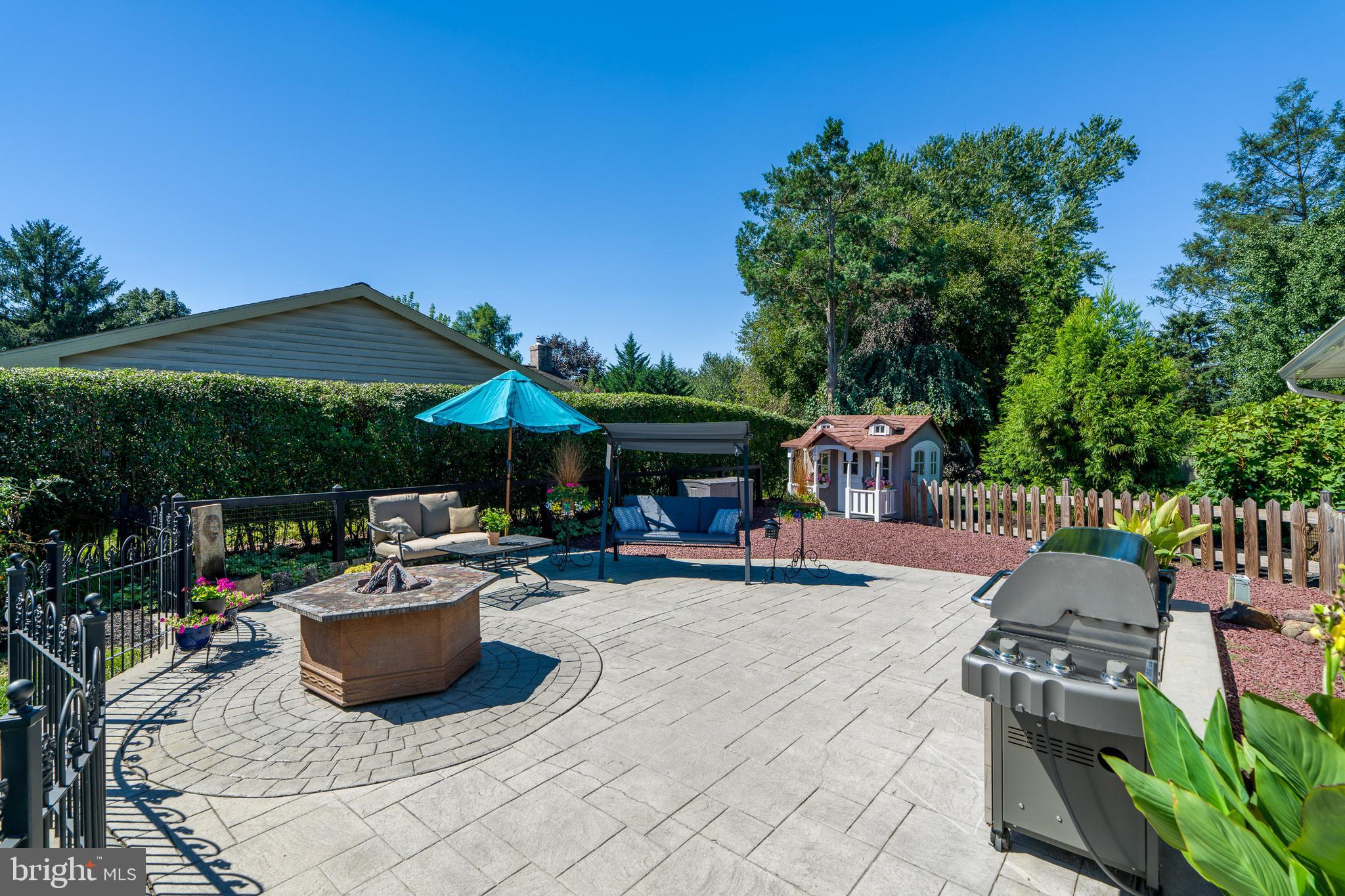 510 Bluebird Road Lititz, PA 17543 - Photo 27 of 32 a view of a patio with table and chairs potted plants and a palm tree