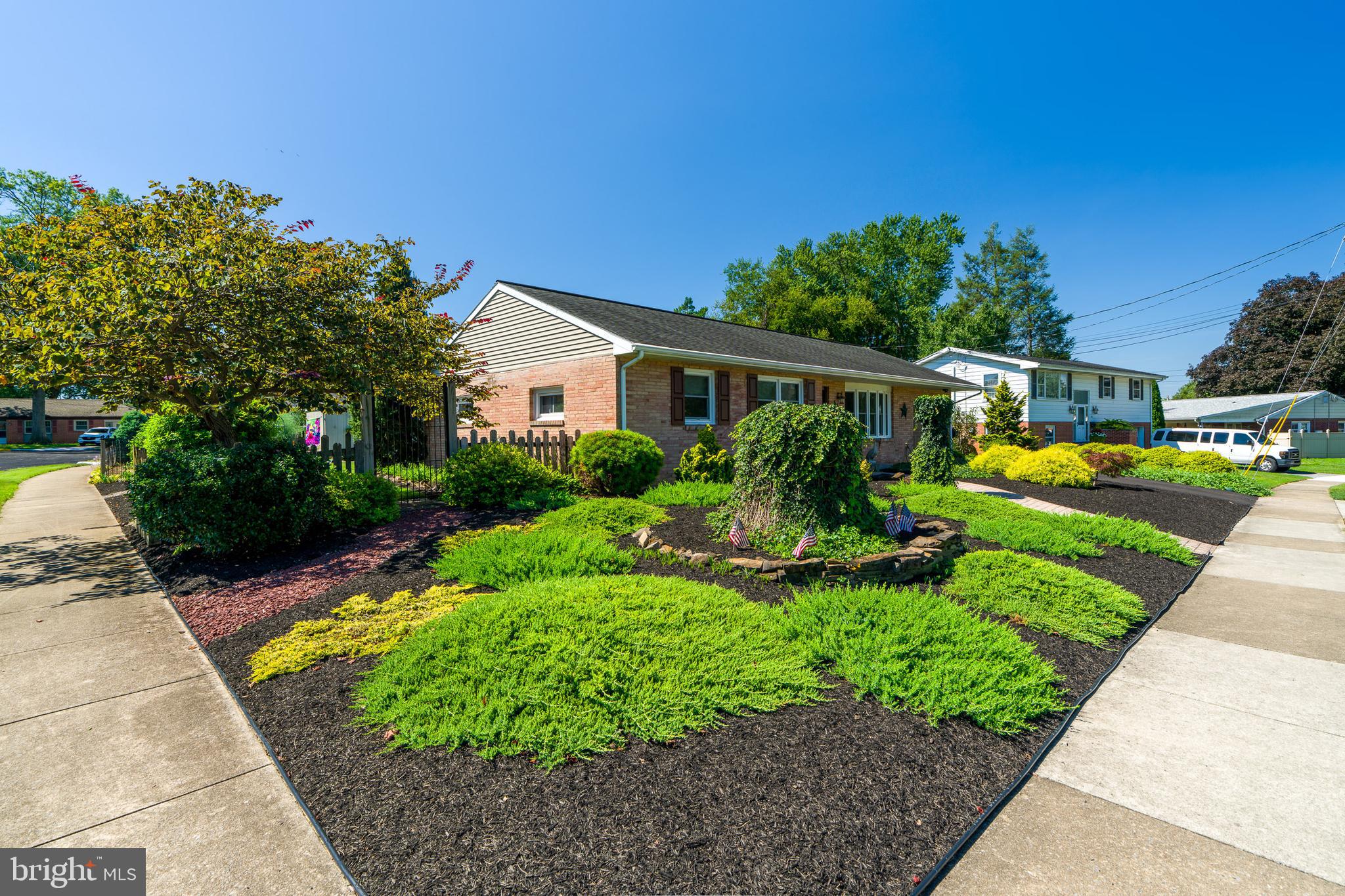 510 Bluebird Road Lititz, PA 17543 - Photo 29 of 32 a view of a house with backyard sitting area and garden