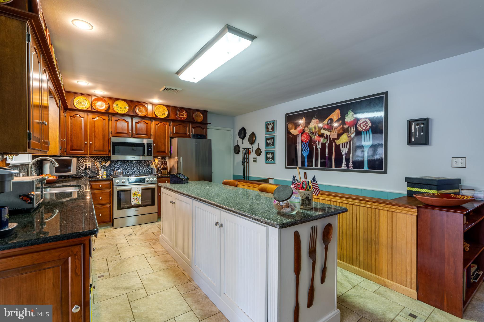 510 Bluebird Road Lititz, PA 17543 - Photo 7 of 32 a kitchen with stainless steel appliances granite countertop a stove and a sink