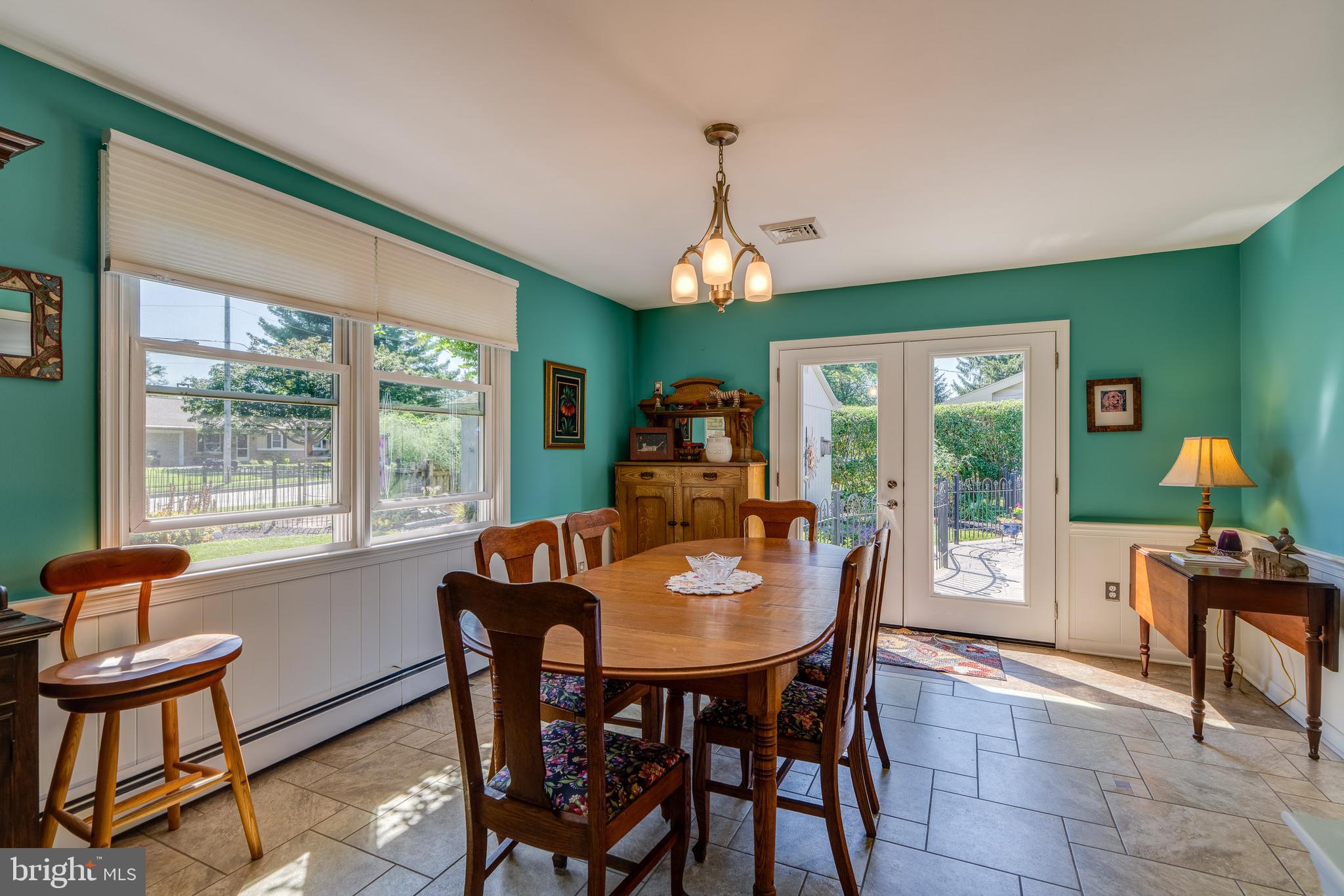 510 Bluebird Road Lititz, PA 17543 - Photo 9 of 32 a dining room with furniture a chandelier and wooden floor