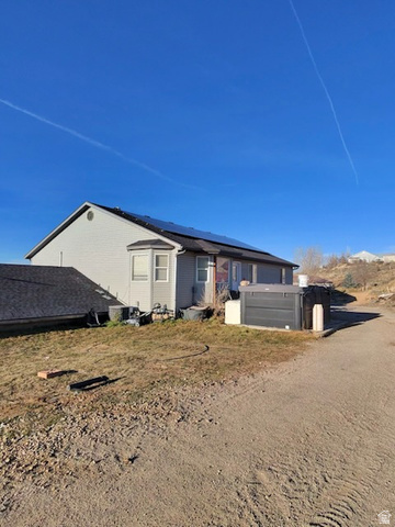 4355 Sagebrush Drive Enoch, UT 84721 - Photo 2 of 13 Back of property with roof mounted solar panels