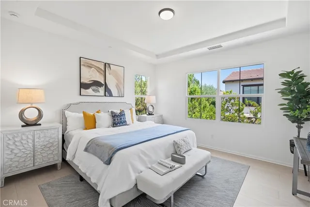 a bedroom with a large bed and a window