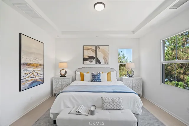 a bedroom with a bed and a couch