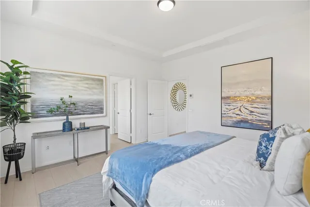 a bedroom with a bed and a desk