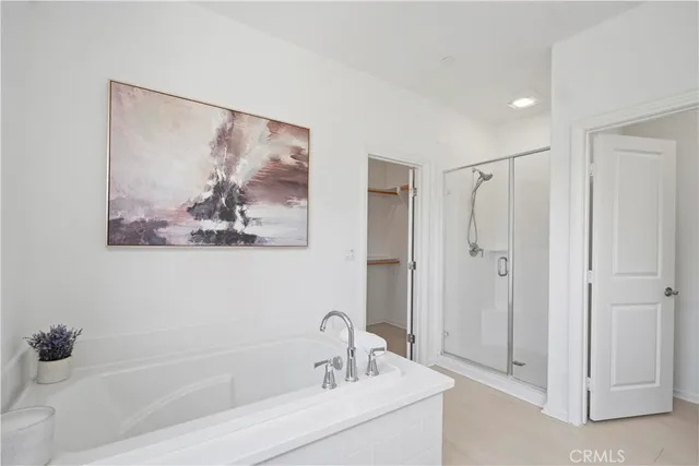 a view of a hallway with a closet and wooden floor