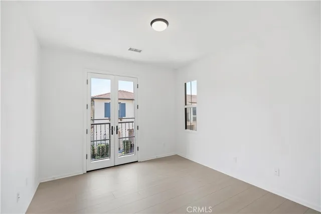 a view of a hallway with washer and dryer