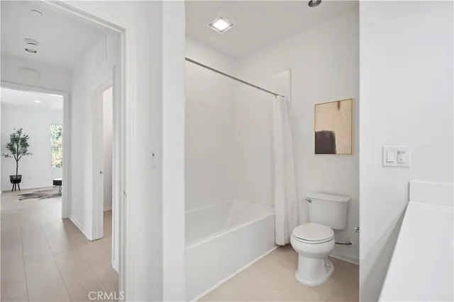 a view of a storage & utility room with racks on the wall