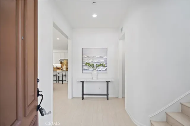 a view of a hallway with front door