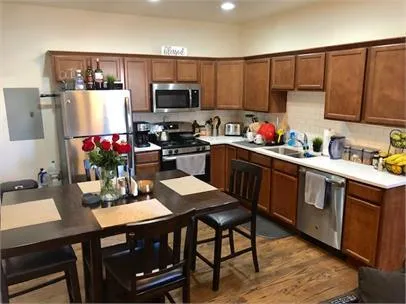a kitchen with a sink cabinets and microwave