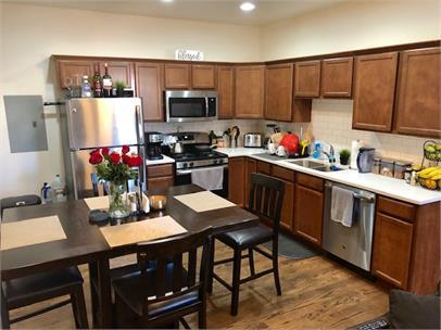 1734 West 35th Street, Unit 1R Chicago, IL 60609 - Photo 2 of 7 a kitchen with a sink cabinets and microwave