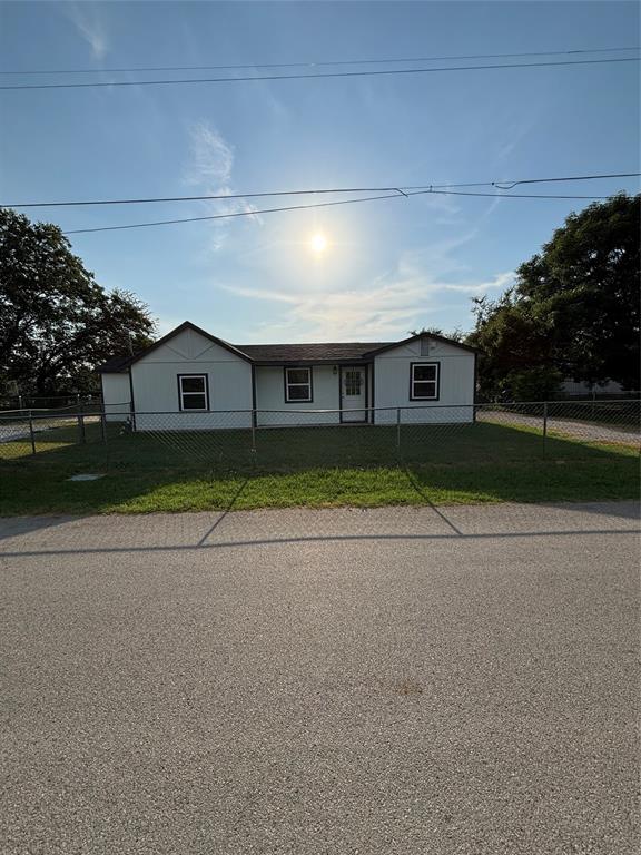 903 1st Street Bridgeport, TX 76426 - Photo 1 of 17 front view of a house with a yard