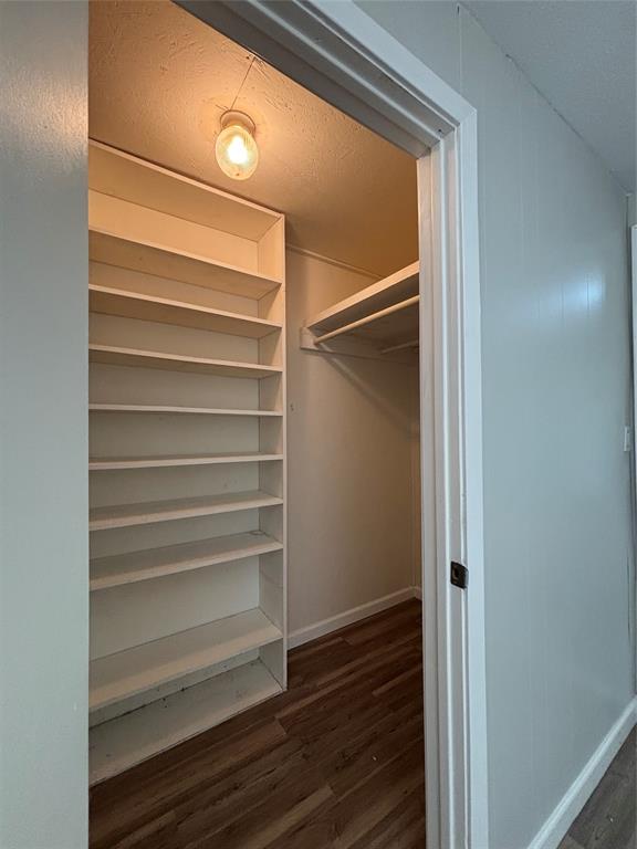 903 1st Street Bridgeport, TX 76426 - Photo 13 of 17 a view of walk in closet with empty racks
