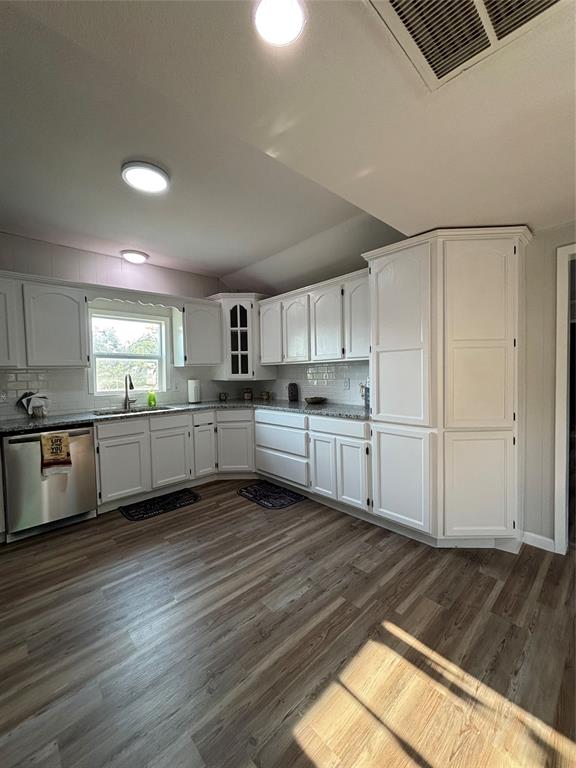 903 1st Street Bridgeport, TX 76426 - Photo 4 of 17 a view of a kitchen with wooden floor and electronic appliances