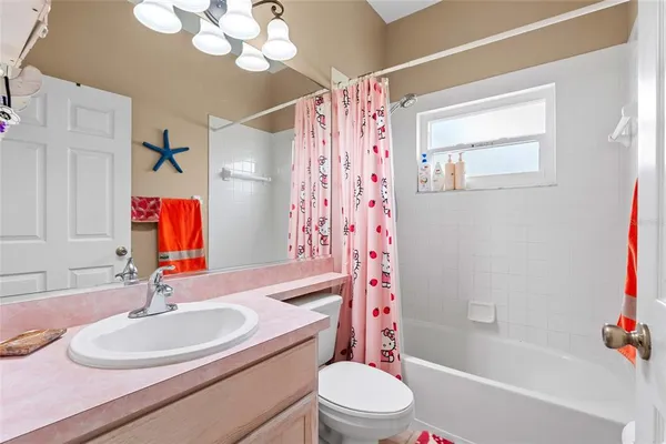 a bathroom with a sink a toilet and a bathtub
