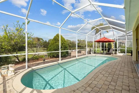 a view of a swimming pool with a porch