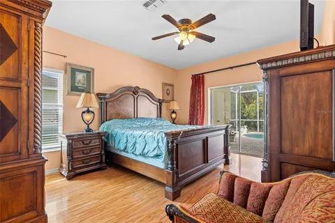 a bedroom with a bed and a chandelier