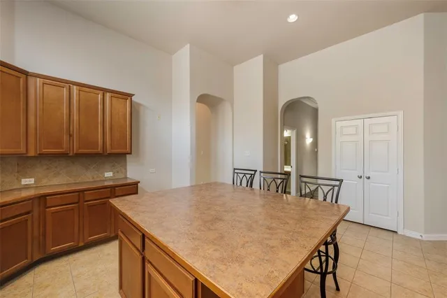 a kitchen with a table and chairs