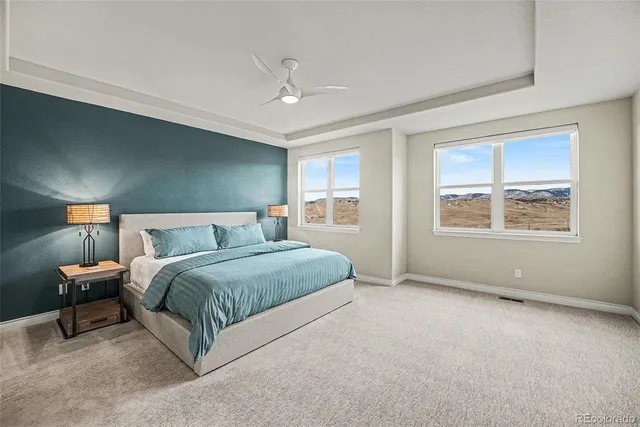 a spacious bedroom with a bed and window