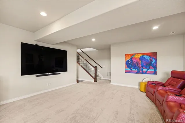 a view of a livingroom with furniture and flat screen tv