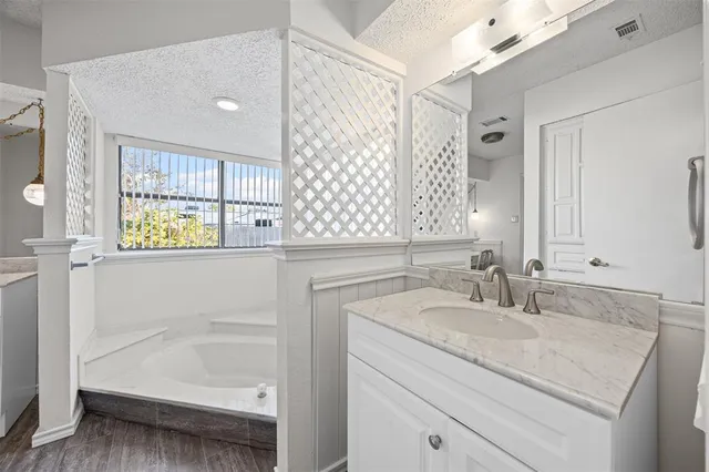 a bathroom with a sink and a bathtub