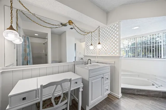 a bathroom with a double vanity sink mirror and