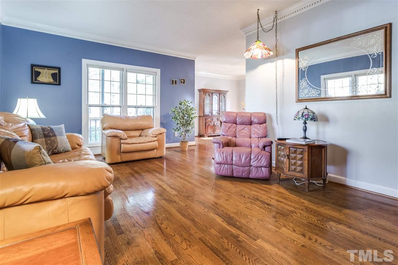 8108 Mourning Dove Road Raleigh, NC 27615 - Photo 11 of 25 a living room with furniture and a flat screen tv
