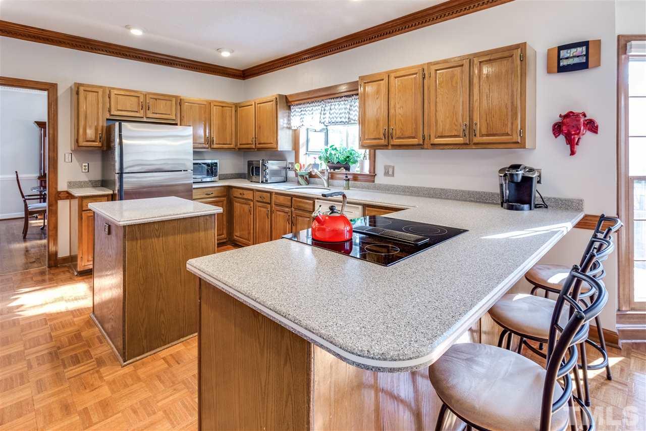 8108 Mourning Dove Road Raleigh, NC 27615 - Photo 14 of 25 a kitchen with cabinets a sink and appliances