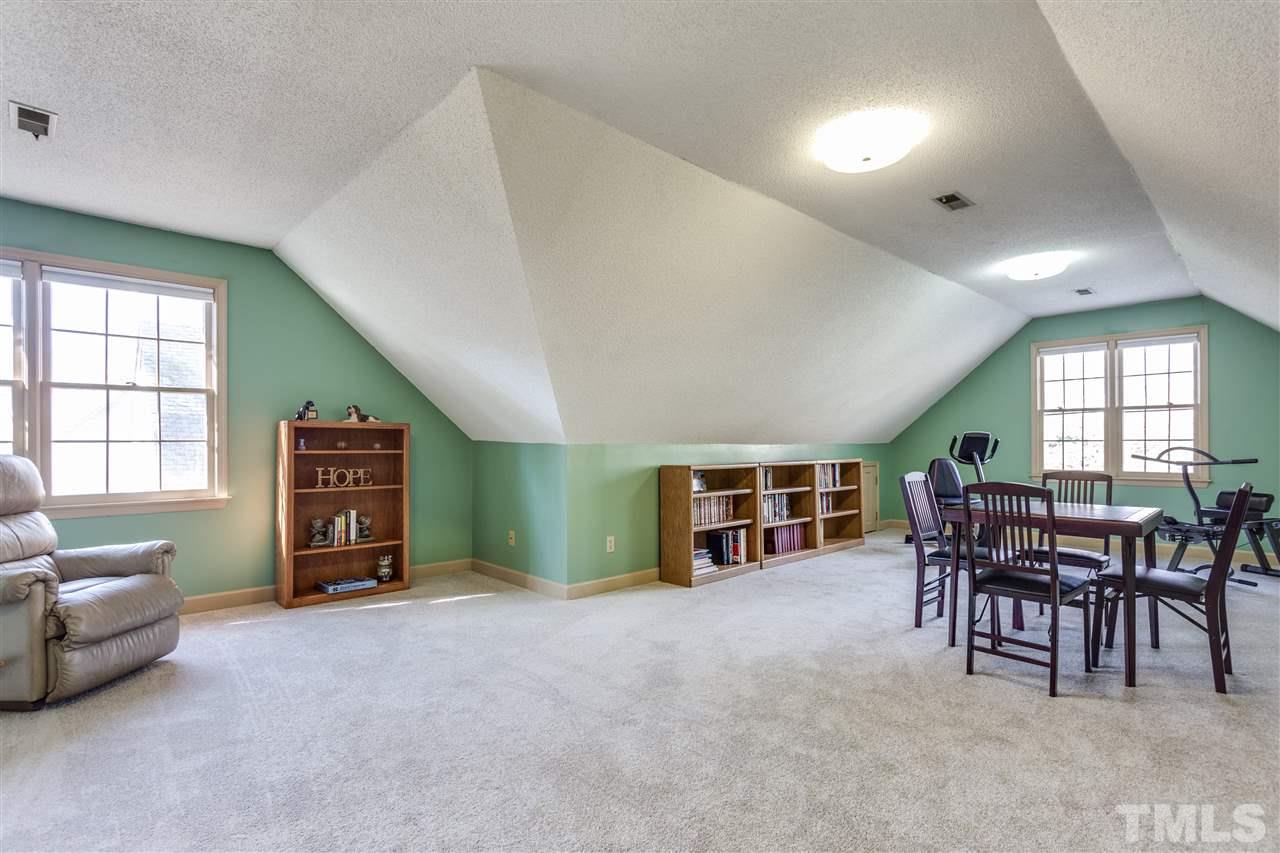8108 Mourning Dove Road Raleigh, NC 27615 - Photo 21 of 25 a view of a livingroom with furniture and window in it