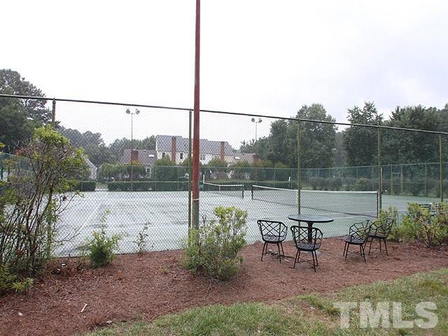 8108 Mourning Dove Road Raleigh, NC 27615 - Photo 24 of 25 a view of a lake with a table and chairs