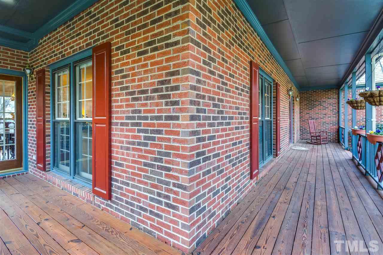 8108 Mourning Dove Road Raleigh, NC 27615 - Photo 4 of 25 a view of a brick house with wooden floor