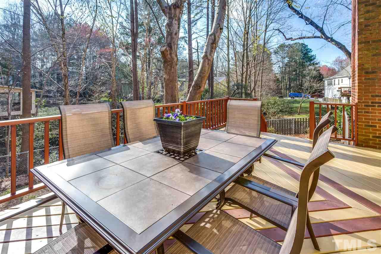 8108 Mourning Dove Road Raleigh, NC 27615 - Photo 6 of 25 a view of a tables and chairs on the roof deck