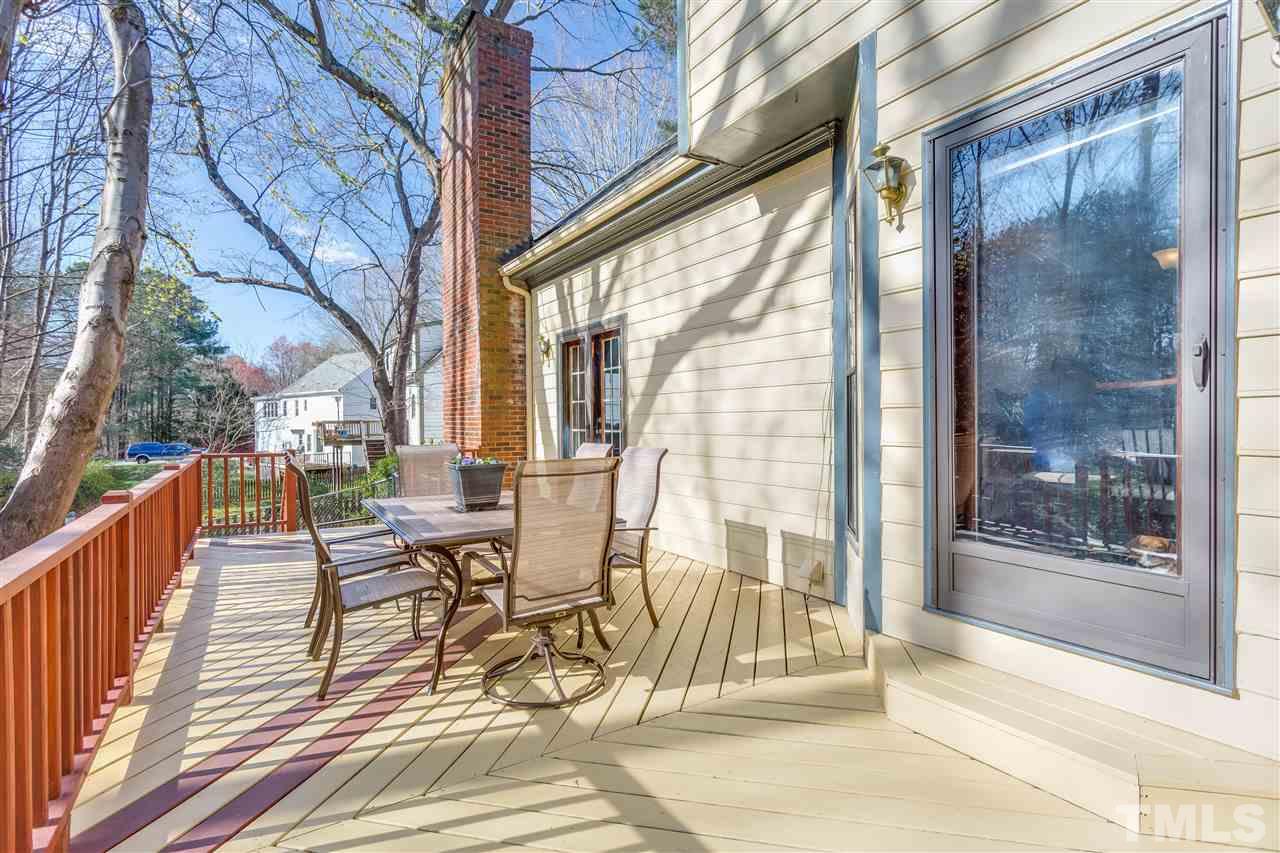 8108 Mourning Dove Road Raleigh, NC 27615 - Photo 7 of 25 a view of a balcony with wooden floor and outdoor seating